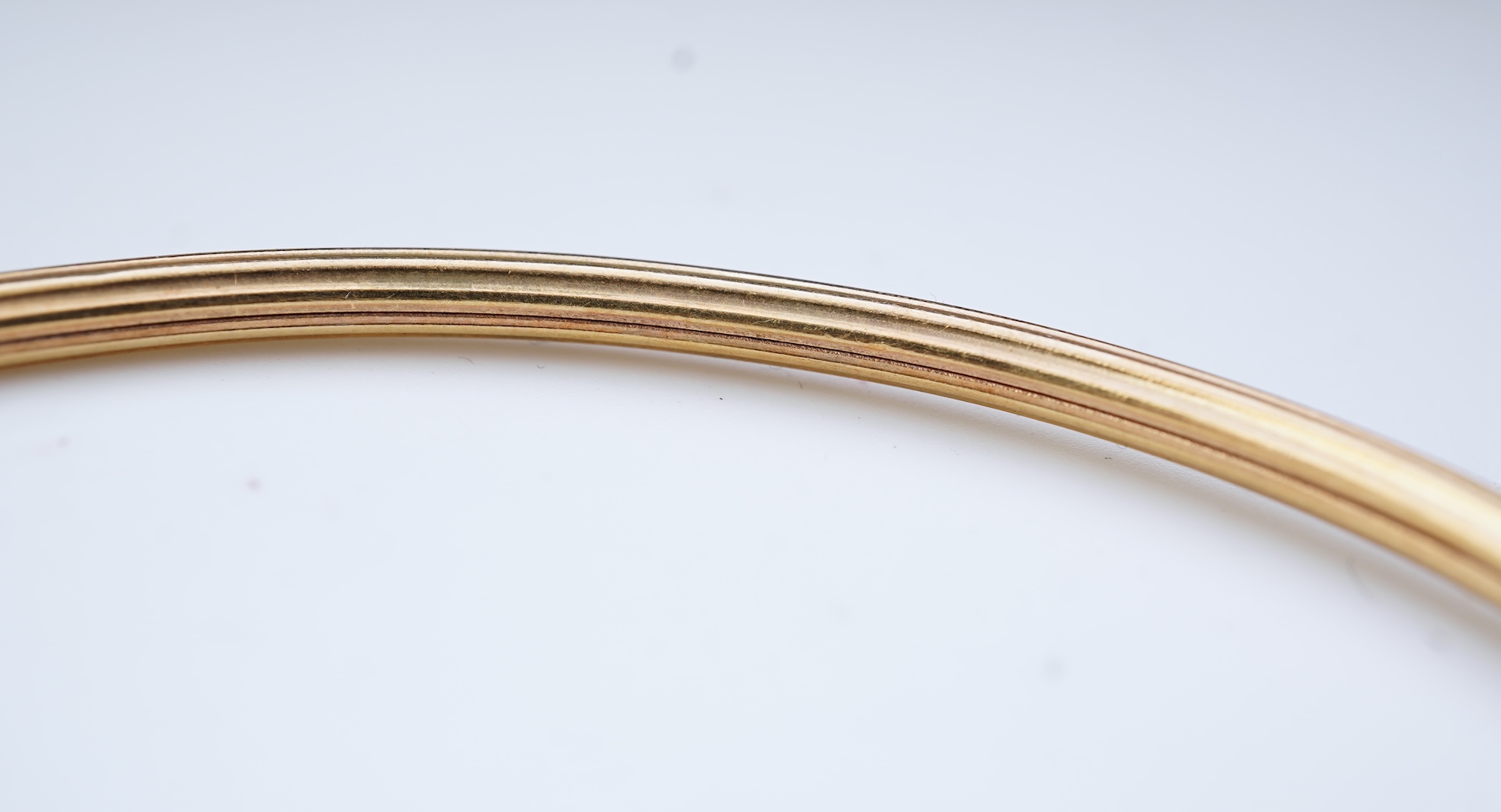 A gold, lapis lazuli and green chalcedony bangle